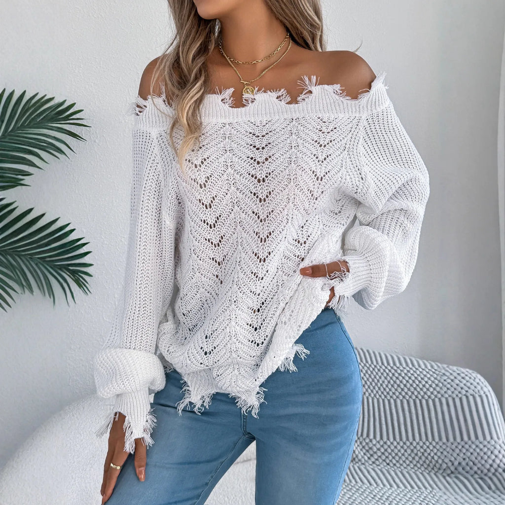 White women's pullover sweater with cut-off-the-shoulder neckline and hollow-out patterned long sleeves.