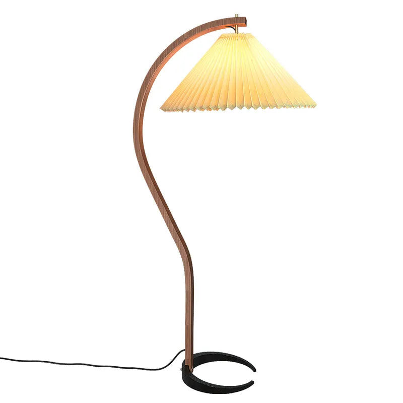 Vertical retro table lamp with a choice of log white or wine red lampshade on a wooden surface.