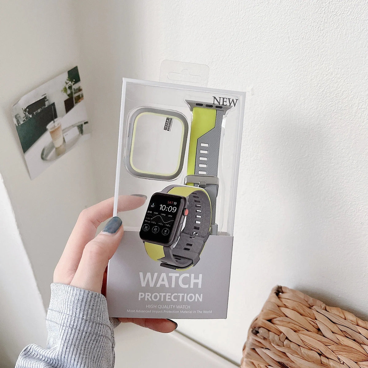 Two-tone silicone protective case for Apple Watch in black and white, fitted on a watch face