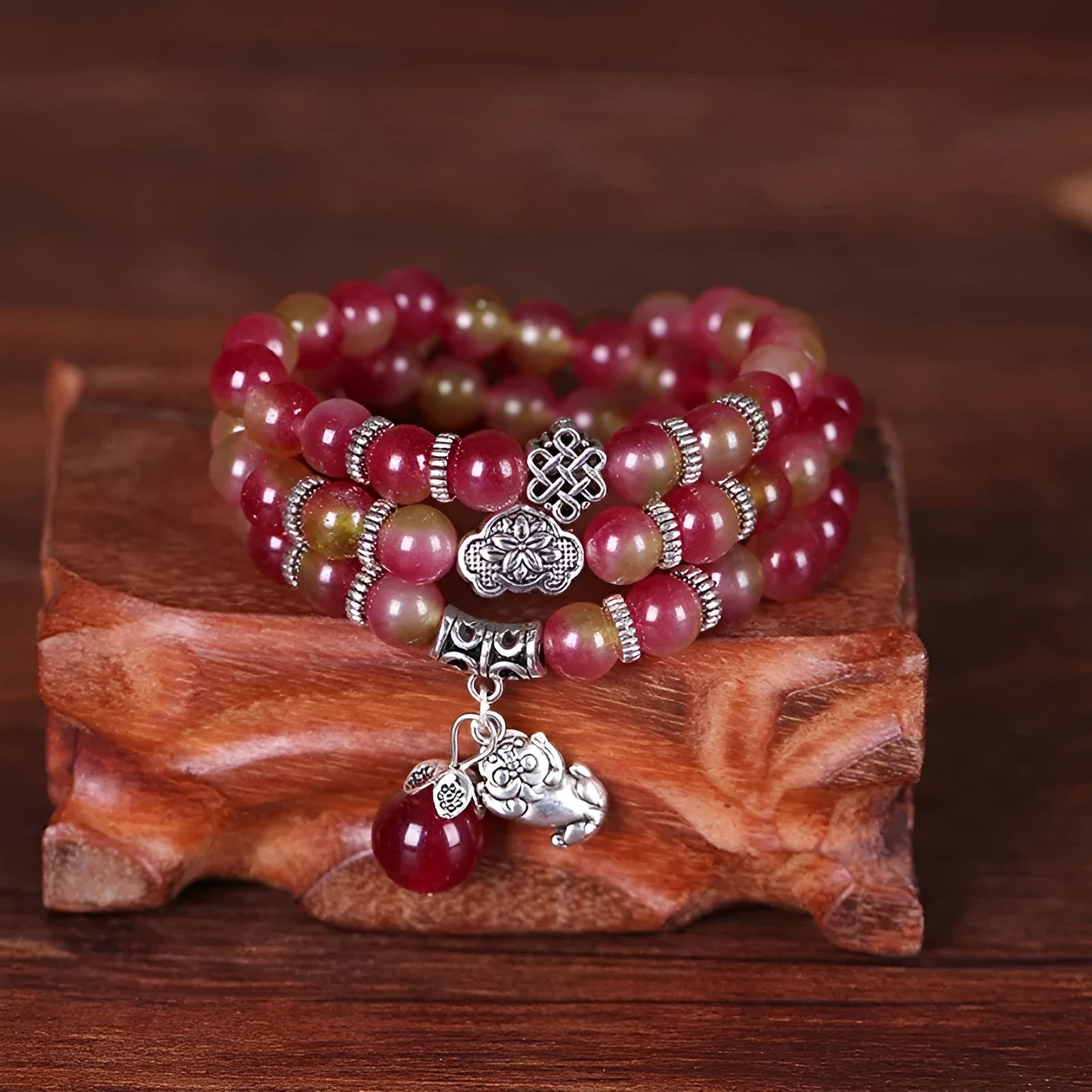 Watermelon crystal bracelet with Chinese knot design showing geometric natural stone beads