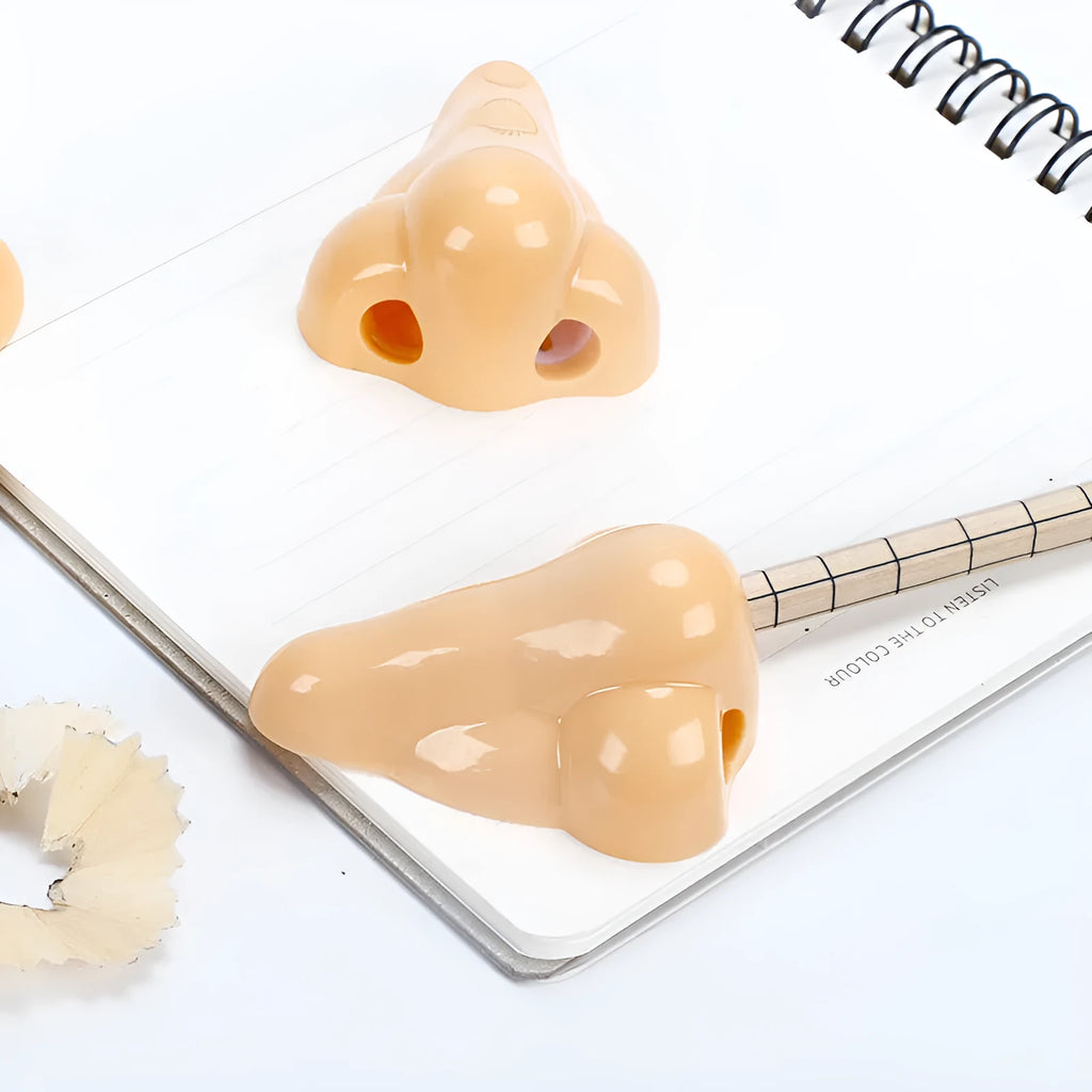 Plastic geometry-shaped manual pencil sharpener in flesh colour measuring 58x45x30mm