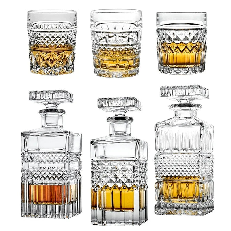 Crystal glass wine set with retro style cups and bottle on table
