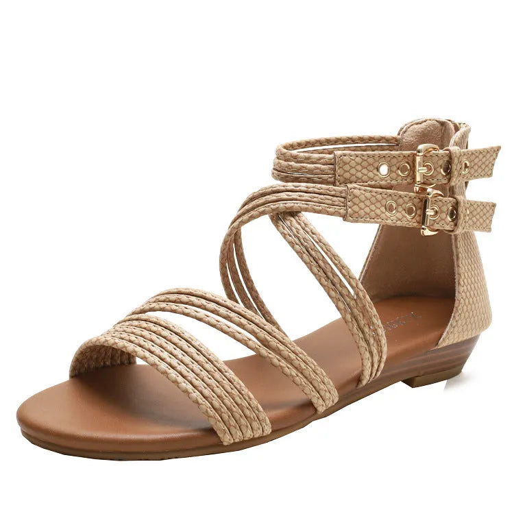 Women's black open toe Roman sandals with cross straps, wedge heel, and back zipper.
