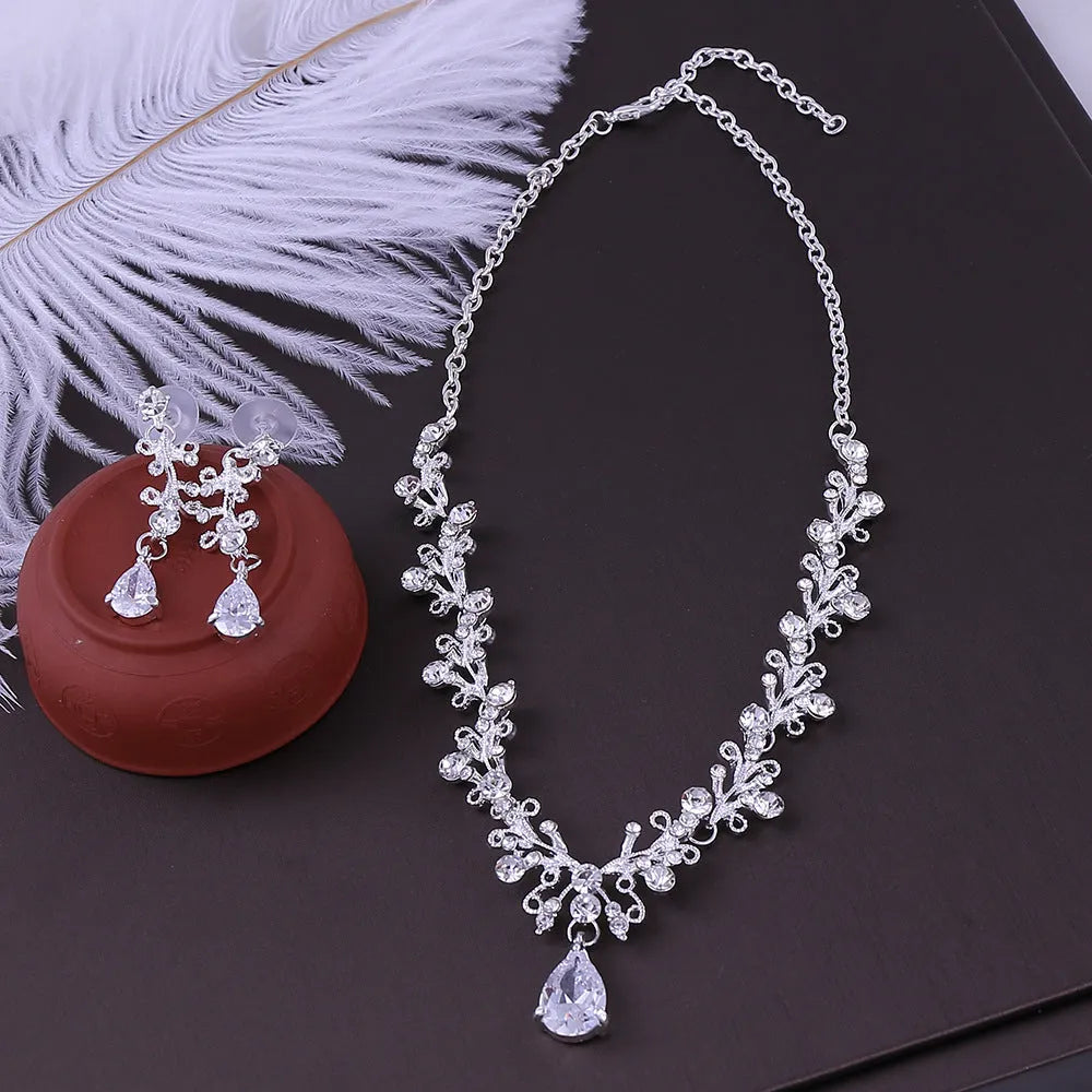 Bridal rhinestone zircon earring and necklace set in silver white finish on alloy base.