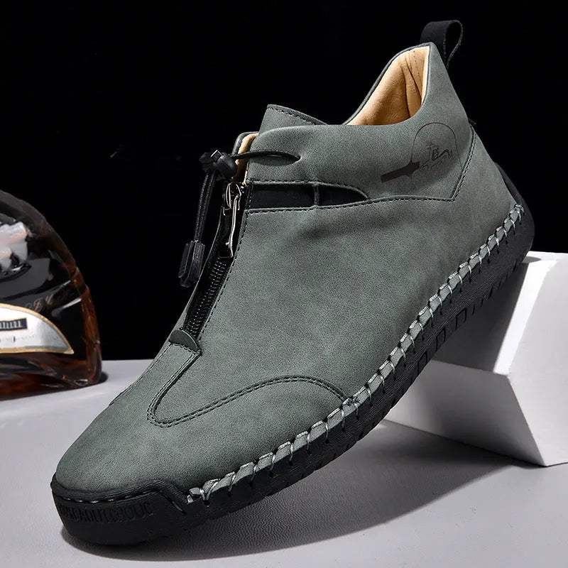 Men's black casual leather shoes with a mid heel and round toe on a rubber sole
