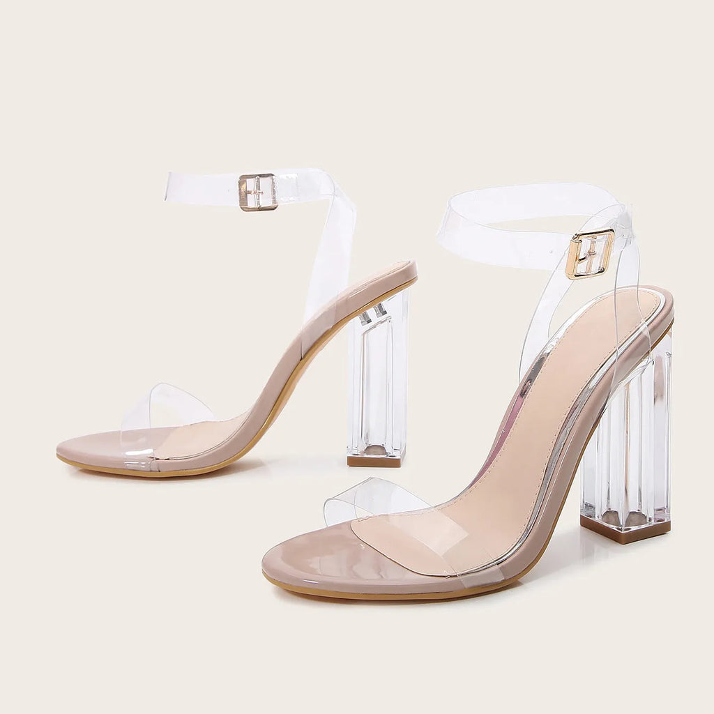 Apricot coloured women's high heel sandals with glass heel, buckle strap, and round toe.
