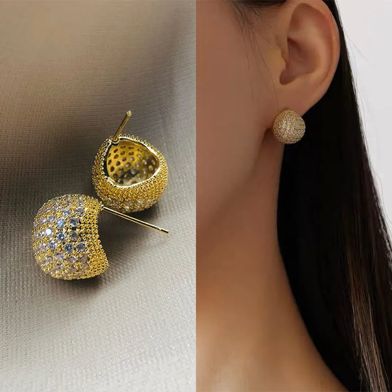 Women's gold and white drop-shaped ear clip earrings with full diamond embellishment and geometric golden beans design