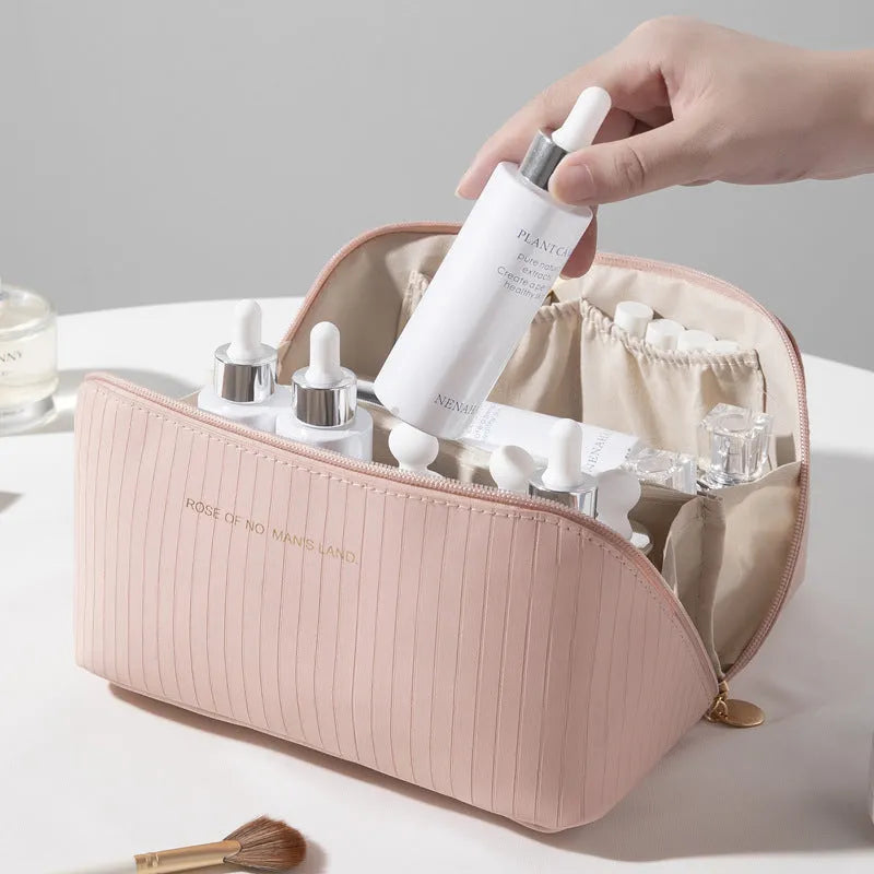 Vertical pattern cubic PU makeup bag in beige, 22.5cm length, for travel cosmetics storage.