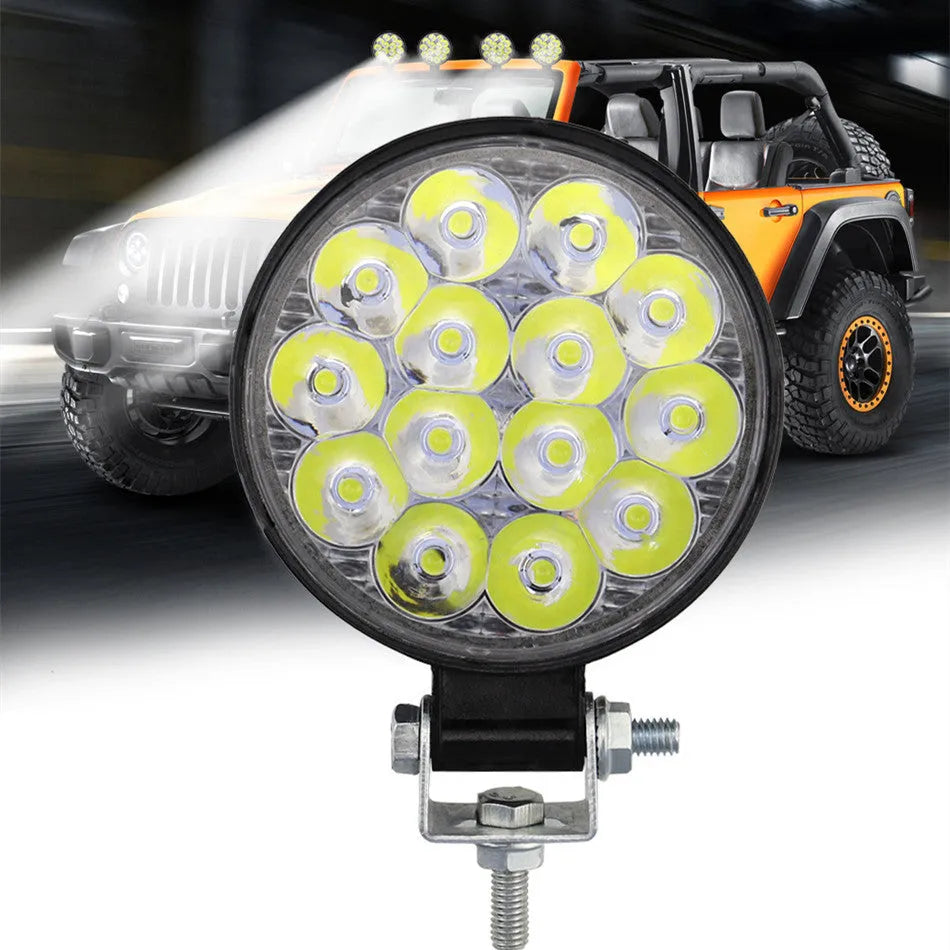 Round white LED work light with aluminium housing for vehicle mounting