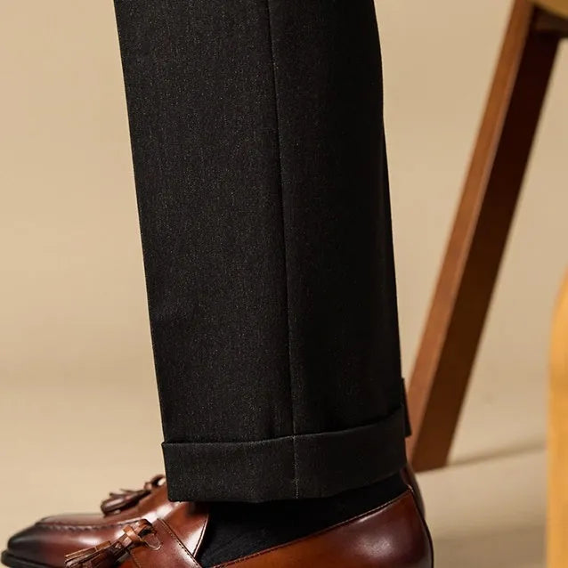 Black and brown business casual loafers with tassel detail and genuine leather upper