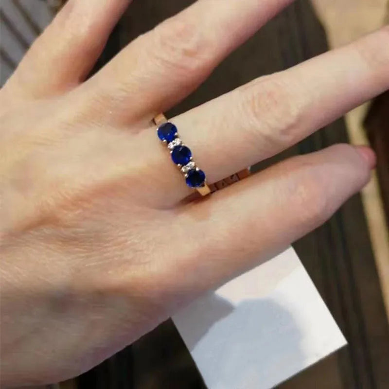 Blue stone ring with adjustable opening, purple and rose gold electroplated copper, geometric live head style