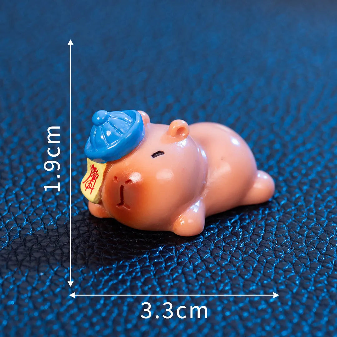Eight different Halloween-themed capybara resin figurines displayed together