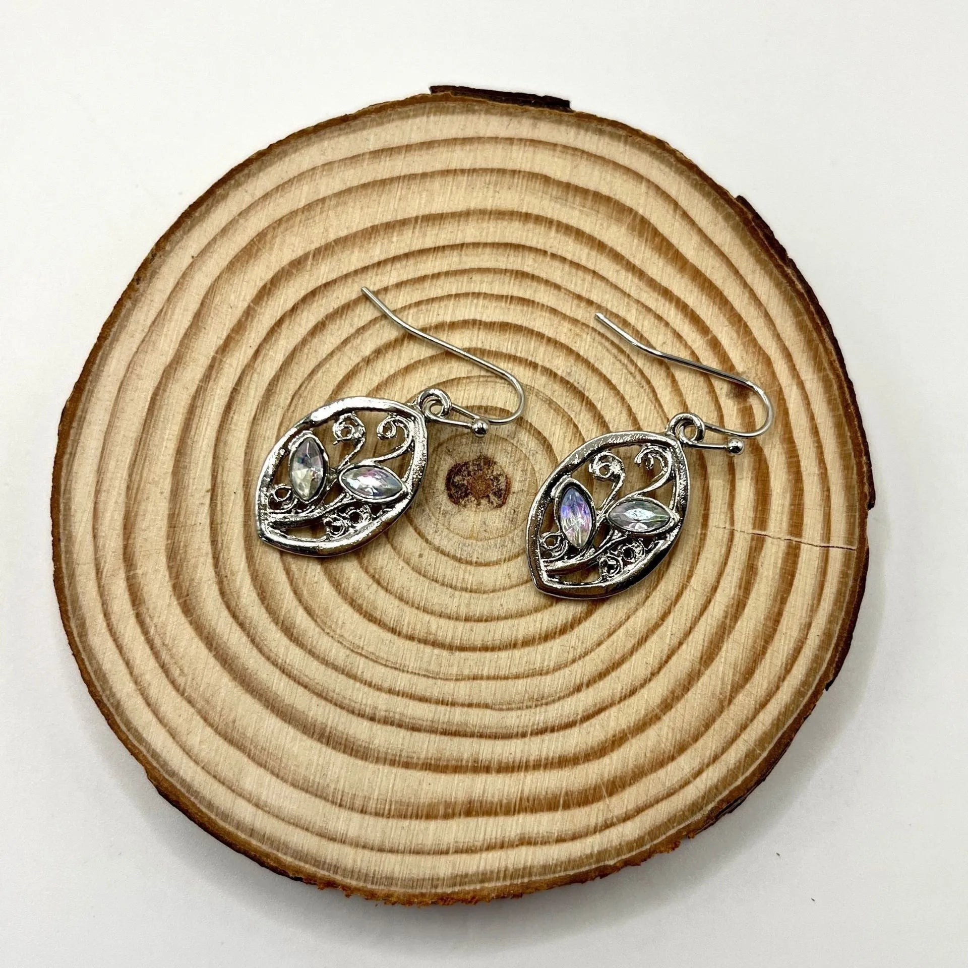 Women's silver leaf-shaped drop earrings with embedded colourful moonstone gemstones