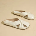 Women's hollow-out half slippers in beige with patent PU leather upper and rubber sole