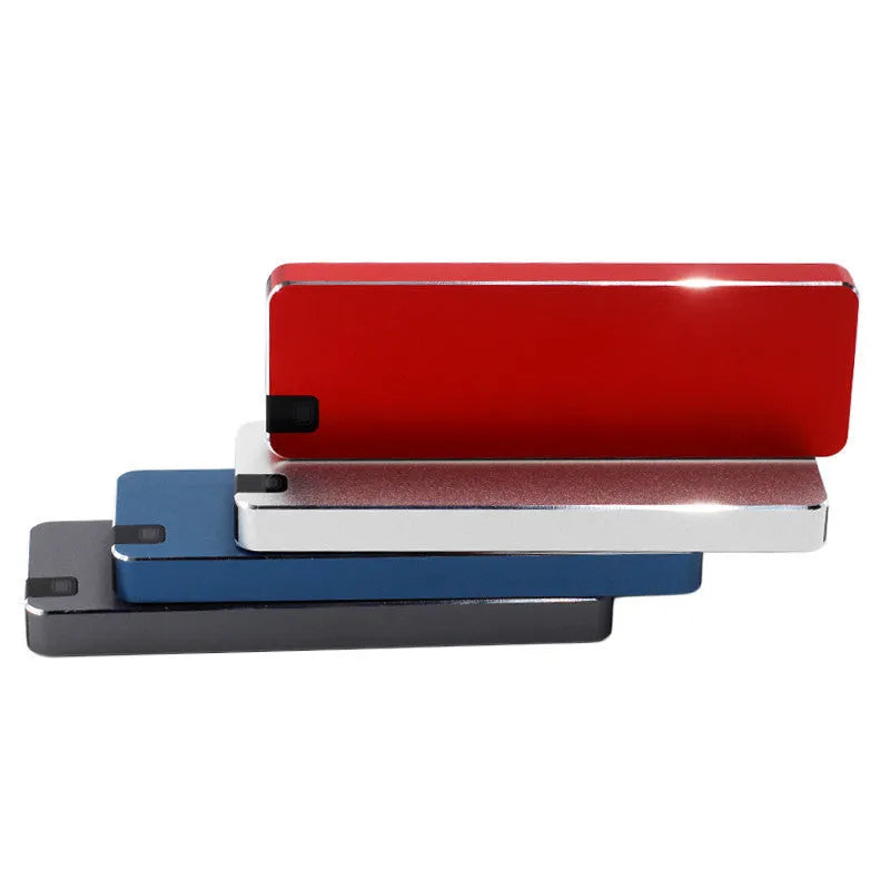 White external solid state drive with metal casing and USB cable, showing compact size for portable storage.