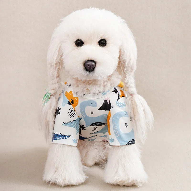 Colourful printed polyester t-shirt for a small dog, showing size chart with chest and length measurements.