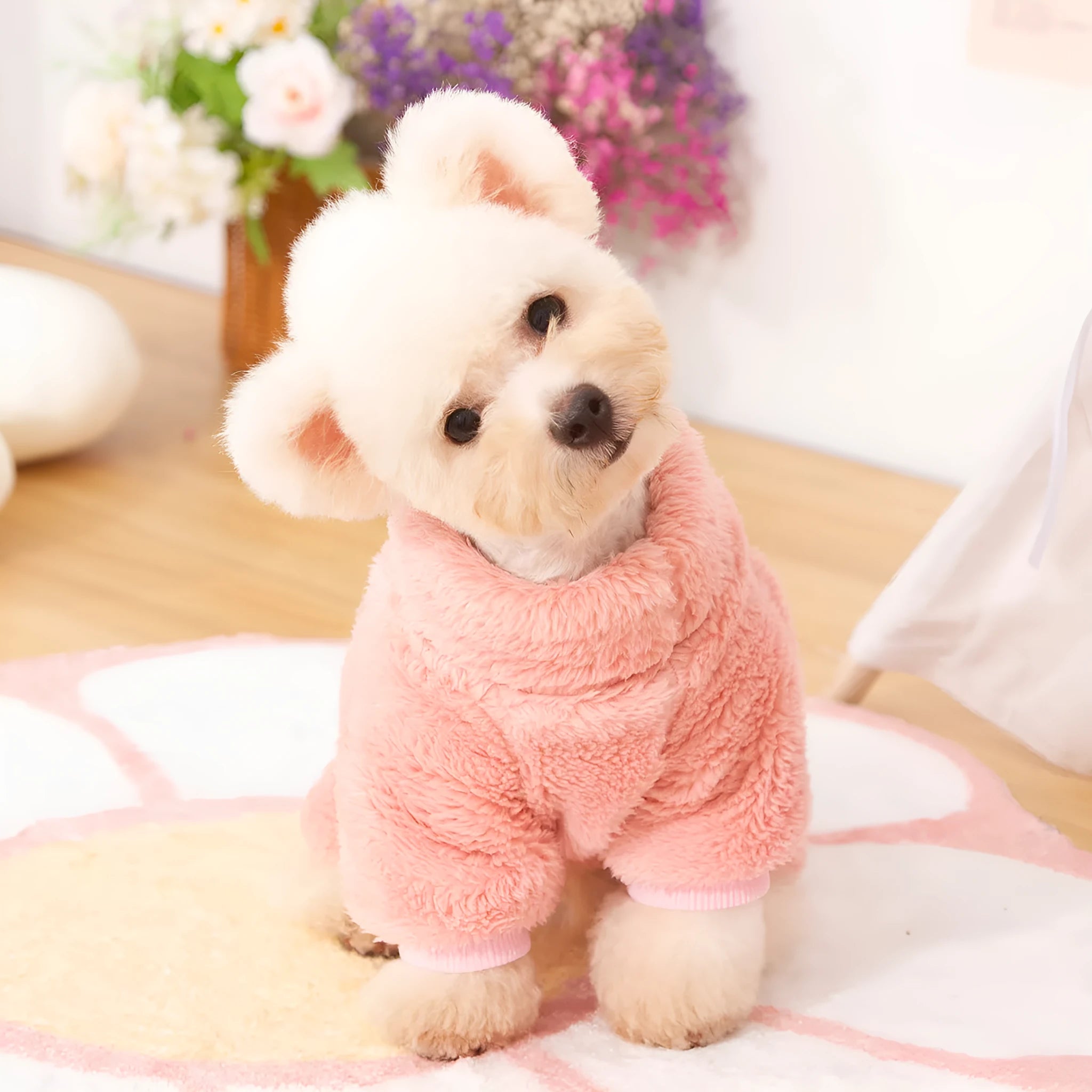 Four-legged dog clothes in blue with high collar and towing ring, showing plush material and full-body coverage