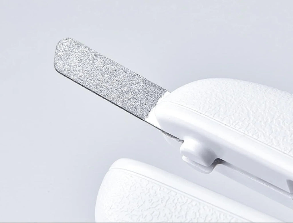 White LED pet nail clipper with transparent splash guard and triangular blade for cats and dogs