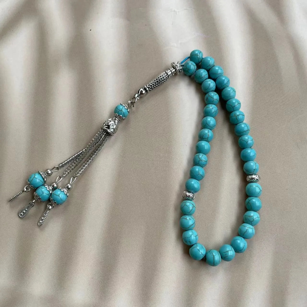 Sky blue Muslim prayer bracelet with 8mm stone beads on adjustable cord