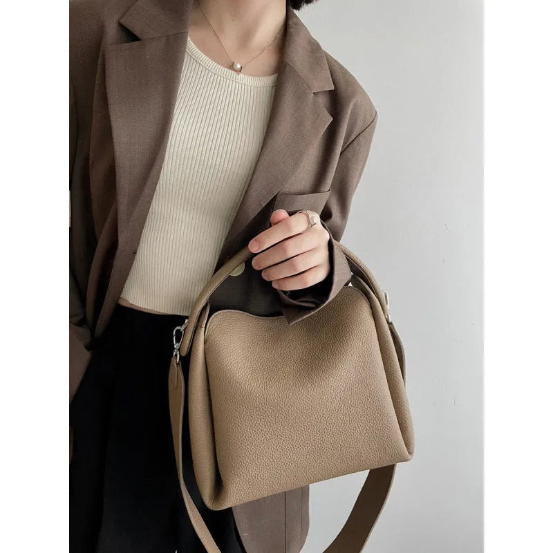 Grey women's corduroy shoulder messenger bag with adjustable strap, 24x10x17 cm, on a plain background.