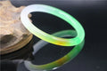 Jade bracelet with floating flower design and auspicious cloud patterns in green colour