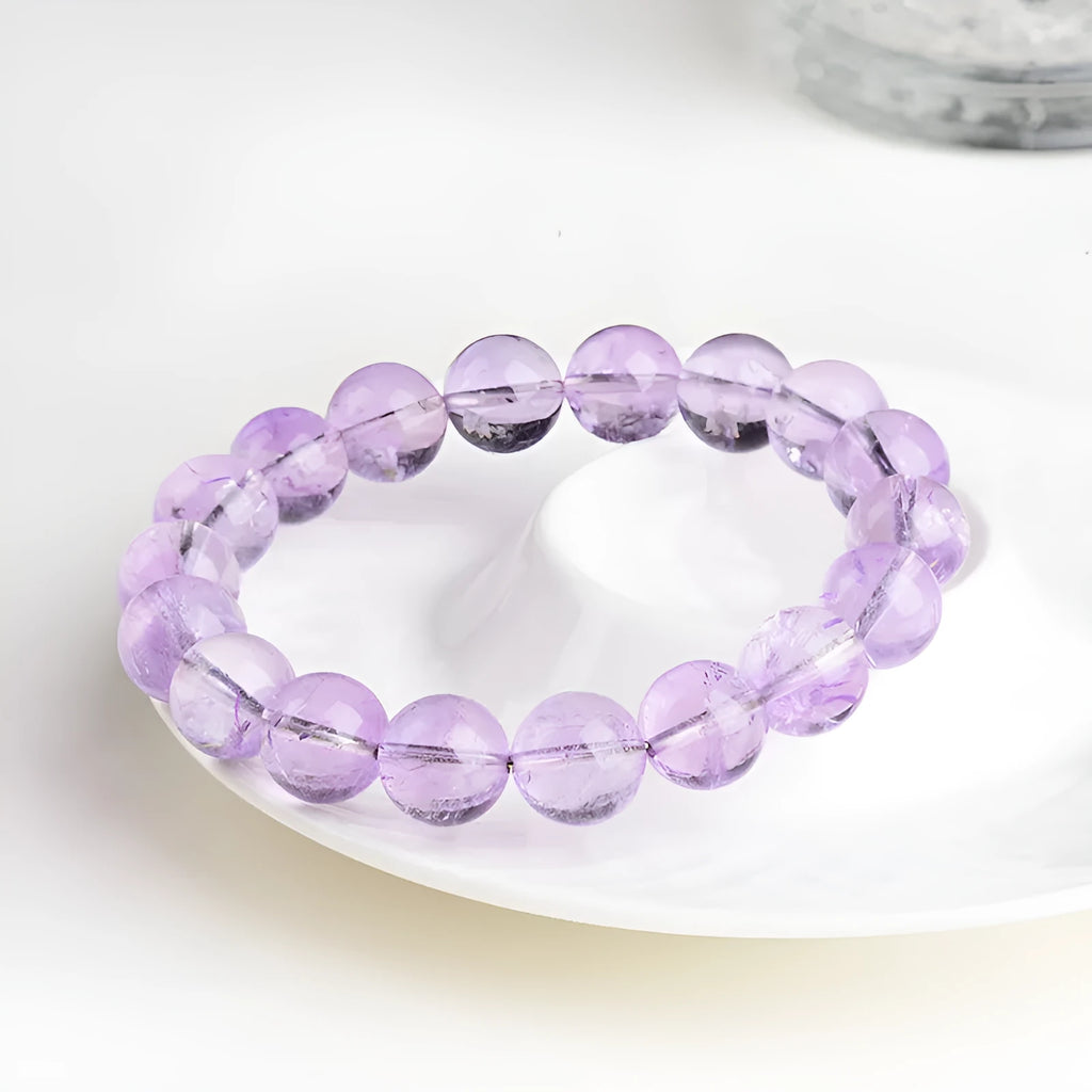 Lavender amethyst crystal bracelet with round beads and water ripple design elements