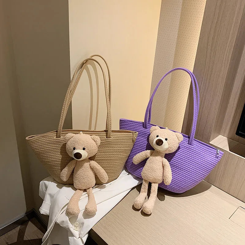 Cotton and linen woven dumpling-shaped shoulder bag with double straps in khaki colour.