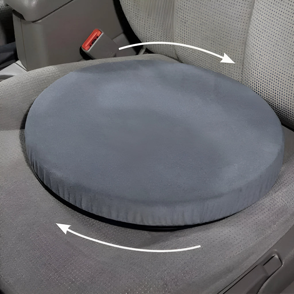 Grey circular car seat cushion with 360-degree rotation feature on a car seat