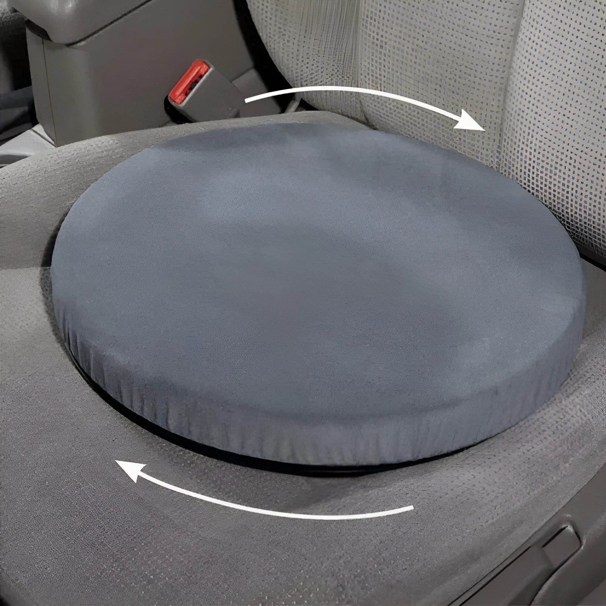 Grey circular car seat cushion with 360-degree rotation feature on a car seat