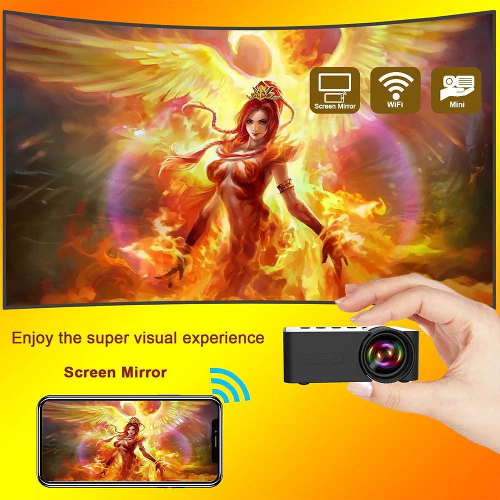 YT100 black mini portable projector on a desk with remote control and USB cable
