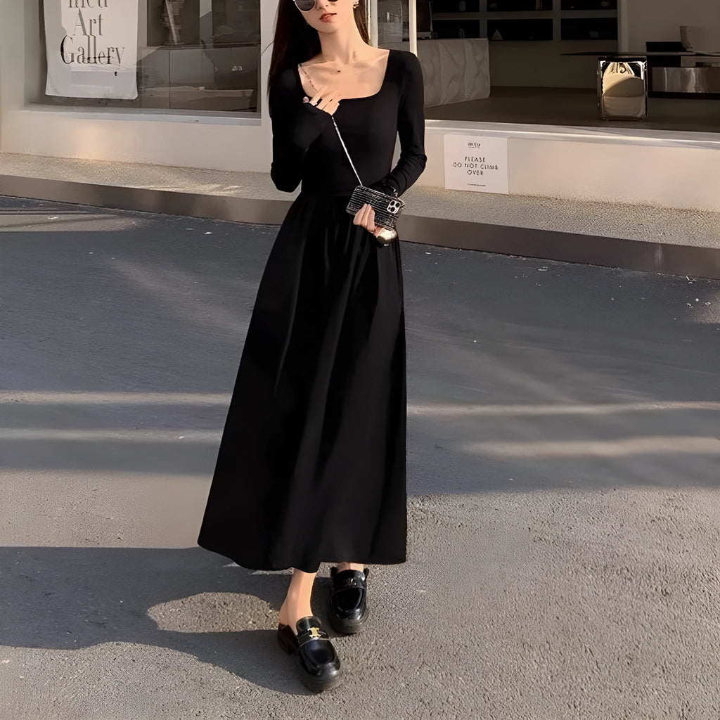 Women's black square collar knitted A-line dress with long sleeves and an elastic waist.