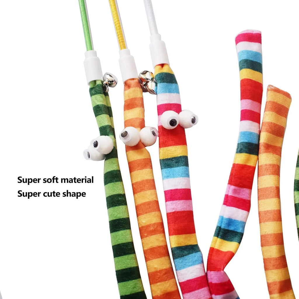 Cat wand toy with a polycarbonate pole and a long colourful plush strip with a bell, held in a person's hand.