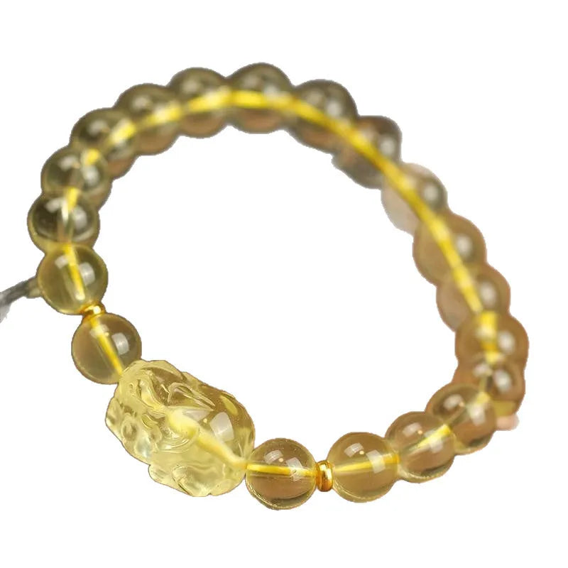 Yellow leather bracelet with a citrine crystal Pi Xiu charm in Chinese national style.