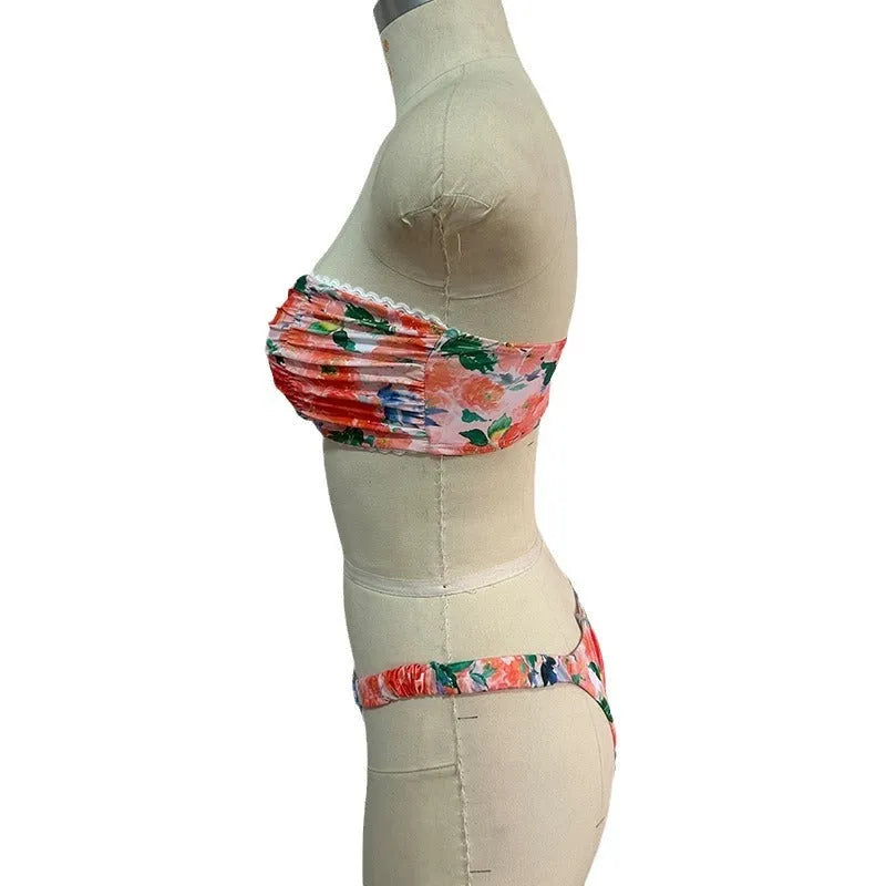 Colourful floral print bikini set with tube top and briefs on a hanger.