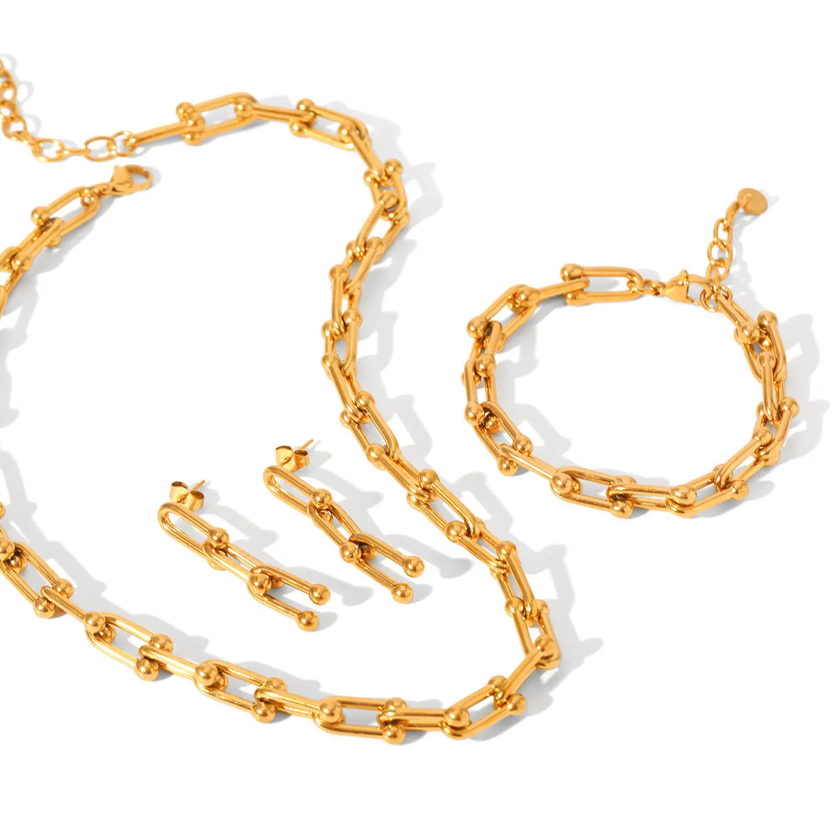 Stainless steel jewellery set with horseshoe design showing necklace, bracelet and earrings in silver finish