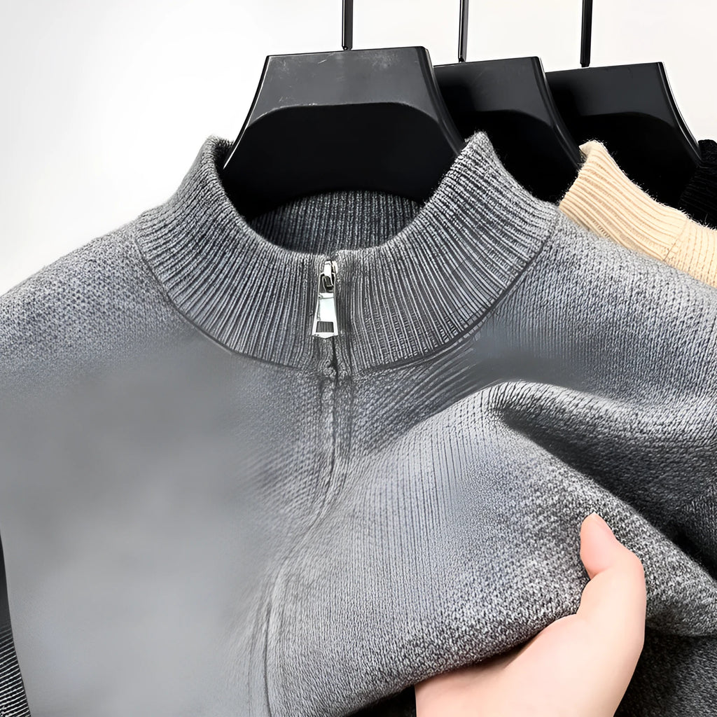 Men's black knitted cardigan with a stand collar and full-length front zipper, shown in a loose fit.