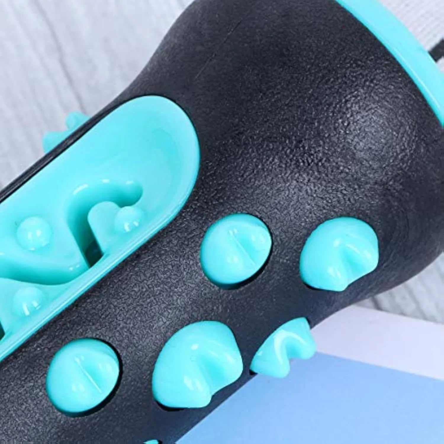 Natural rubber dog dental chew toy in blue, green, yellow, or black blue, showing textured cleaning surfaces.