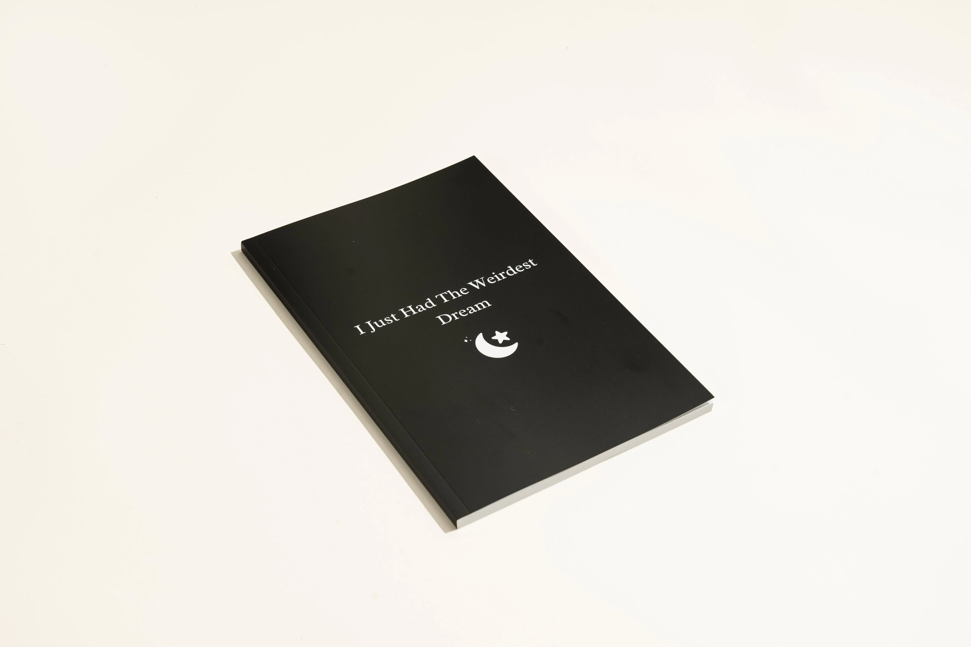 A5 black dream journal notebook with dot grid pages for dream recording