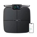 Black rectangular eight-electrode body fat scale on a flat surface