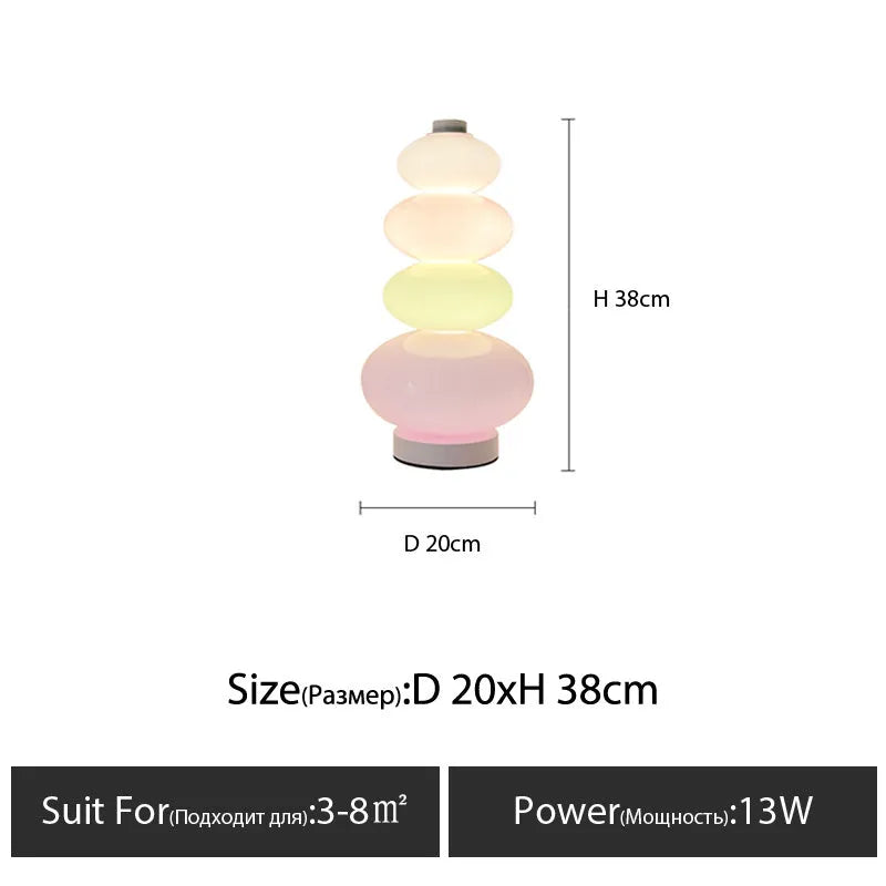 Candy String Rainbow Floor Lamp in creative macaron style with glass shade and iron body on a wooden table