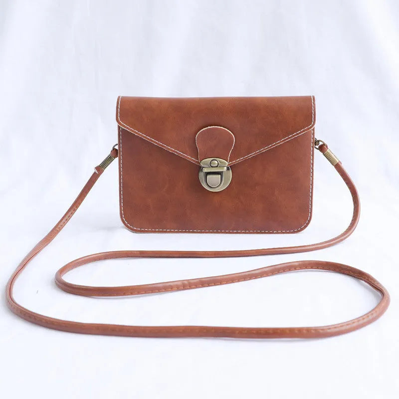 Retro messenger bag in wine red with flap closure and crossbody strap shown alongside black and light brown colour options