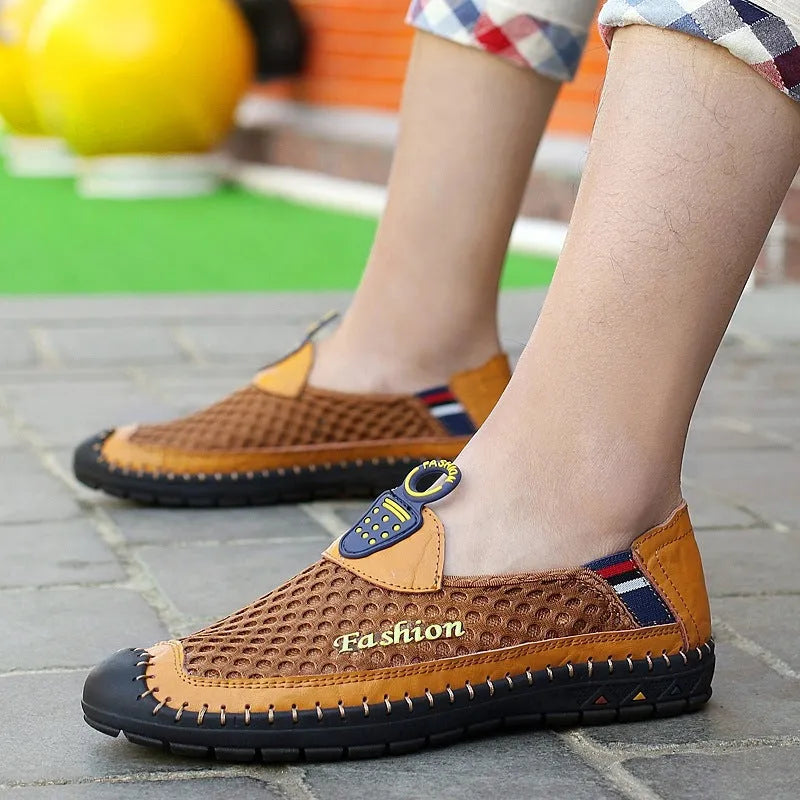 Men's brown breathable mesh casual slip-on shoes with a round toe and rubber sole on a white background.