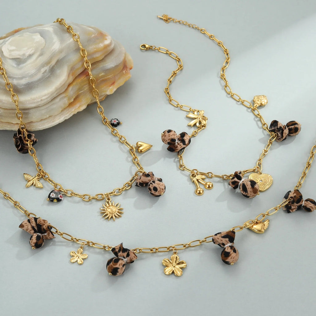 Geometric leopard pendant necklace with love heart and flower engravings on gold-plated chain