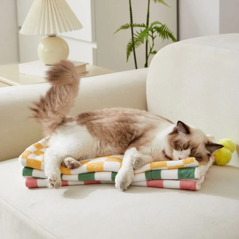 Green plaid pet blanket with soft fleece surface for cats and dogs