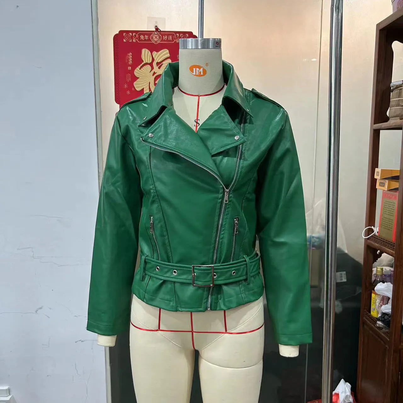 Punk short belt lapel jacket in leather-look polyester with a Peter Pan collar.