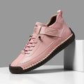 Men's mid-top Martin boot in khaki with tooling stitching and an elastic band ankle closure.