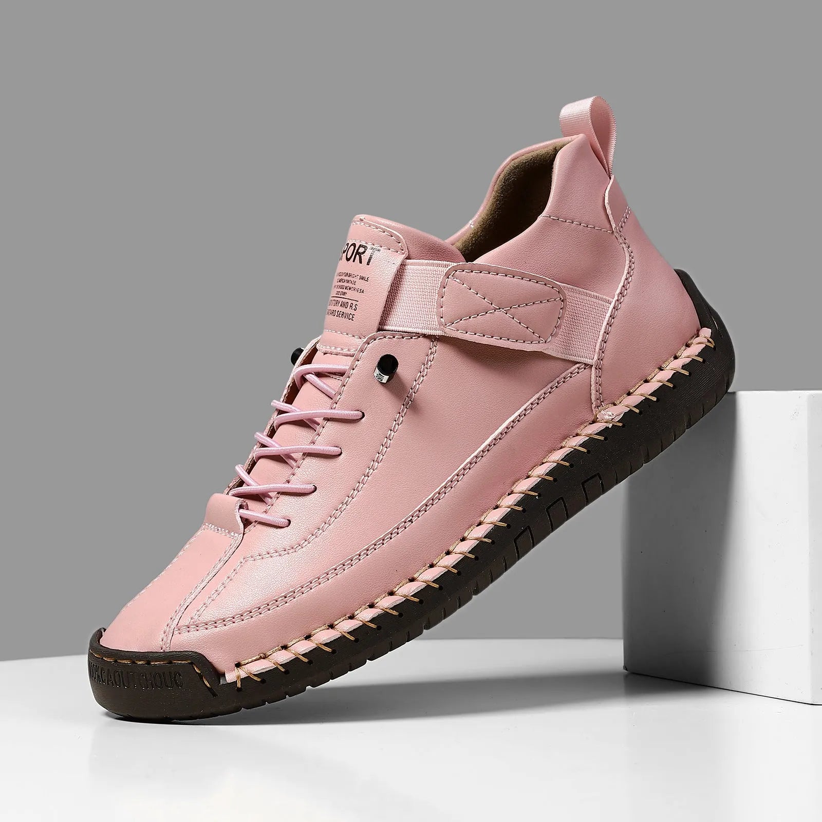 Men's mid-top Martin boot in khaki with tooling stitching and an elastic band ankle closure.