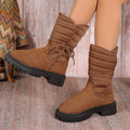 Women's black chunky heel snow boots with lace-up front and fleece lining.