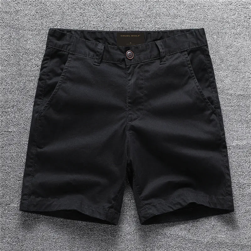 Men's green camouflage cotton workwear shorts with zip fly on a mid waist.