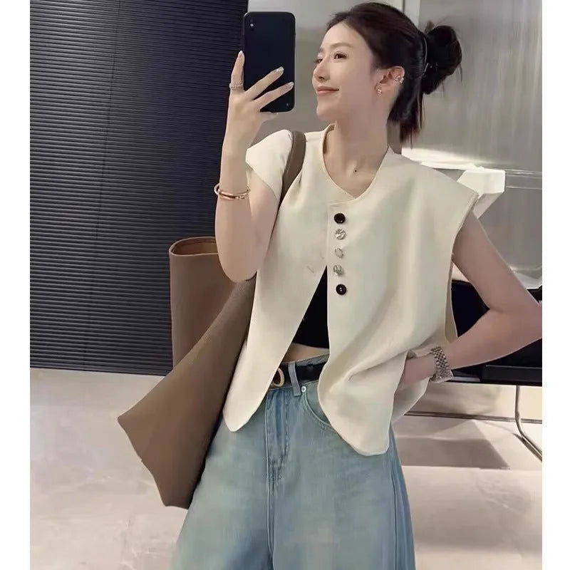 Women's loose fit polyester vest in milky white, showing front view with pockets.